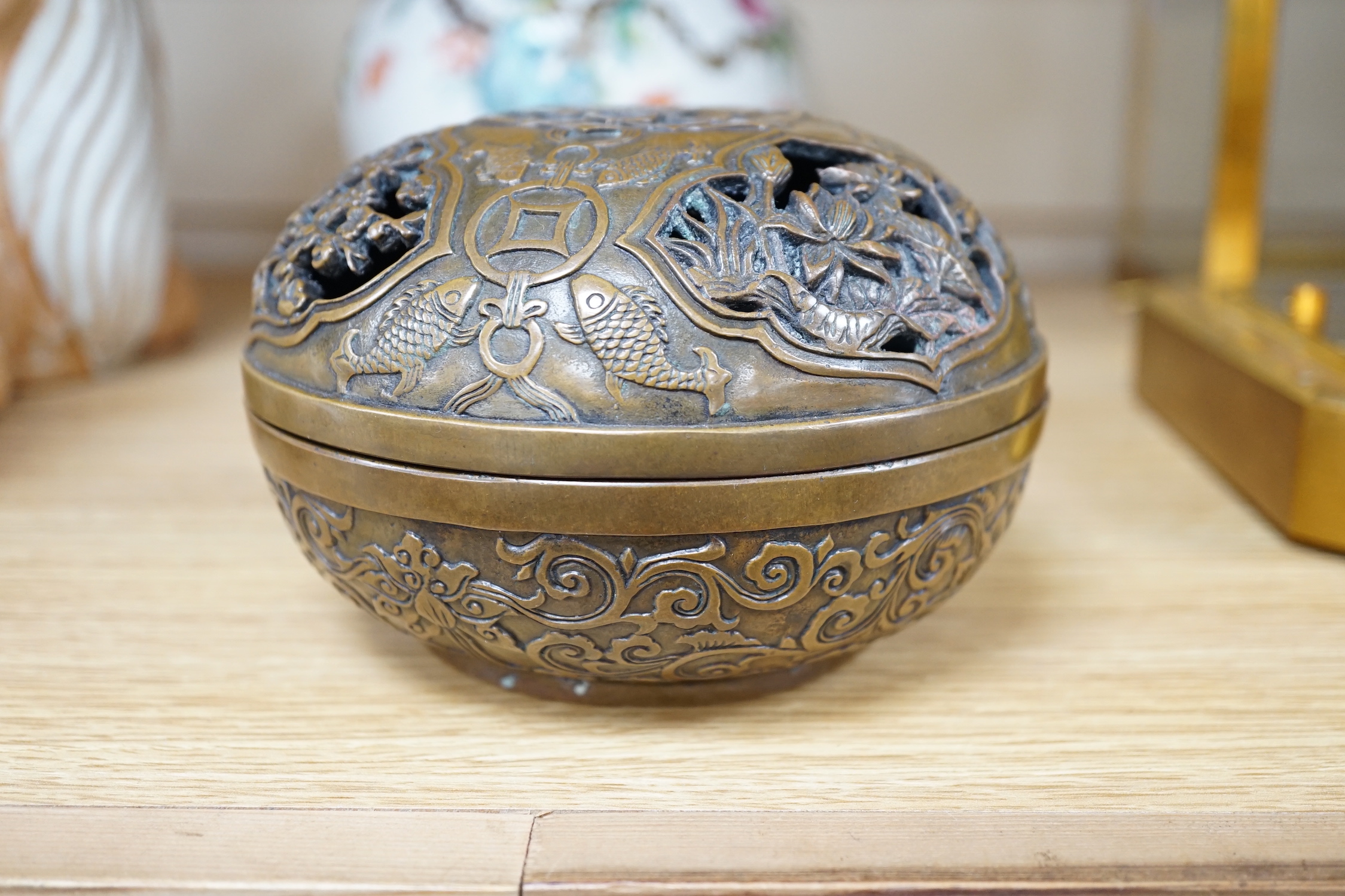 A Chinese circular carved bronze censer, 13.5cm diameter